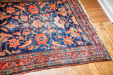 Worn deep indigo blue pile and coral motifs with distinct abrashes on the Lilihan rug.