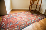 Colorful worn antique Caucasian rug, geometric red and blue design, 3'4