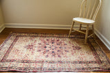 Antique Persian Kerman rug, blanched ivory field with cochineal red medallion, scrolling spandrels, 3'3