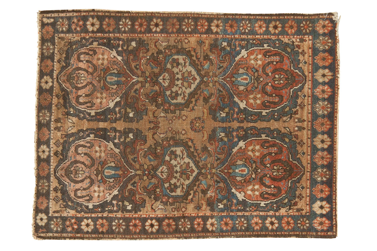 Antique Farahan Sarouk rug mat featuring unusual cloudband motifs in earth tones, blue, charcoal, and coral, 2'1" x 2'9".
