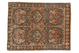 Antique Farahan Sarouk rug mat featuring unusual cloudband motifs in earth tones, blue, charcoal, and coral, 2'1