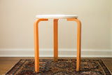 Vintage Mid Century Alvar Aalto style stool, orange chippy paint, unique ivory curved top.