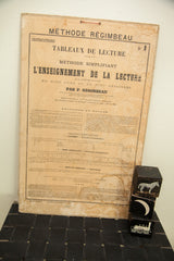 Lower right of antique French school chart, showing aged paper, moisture residue, and decorative blocks.