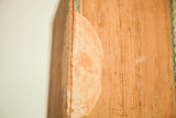 Patina on antique Cuban cigar box wood with faded factory label detail.