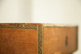 Late 19th century Cuban cigar box corner with intricate green scalloped border design.
