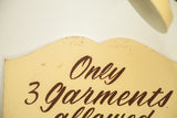 The semi-scalloped wooden top of the vintage sign showing authentic age and wear.