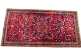 Vintage Red Sarouk Persian rug with central medallion and saturated floral design, 2'1