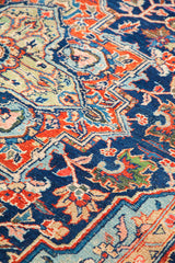 Lustrous, saturated blue field and mint green medallion of vintage Heriz rug.