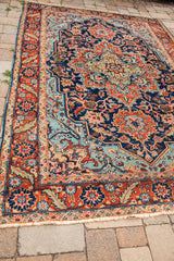 Vintage Heriz rug features a unique blue field, mint green medallion, and saturated, lustrous hues.
