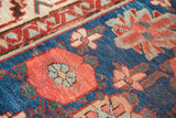 Intricate floral Veramin motif on the antique Persian runner, featuring blue, wine red, and mallard green.