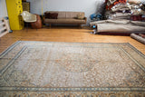 Distressed vintage Tabriz rug, covered field design of silver, ivory, rust, and blue.