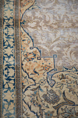 Distressed Tabriz Persian rug with ivory, blue, rust curvilinear border and faded field pattern.