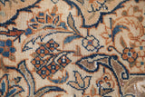 Distressed texture and unusual covered field design in rust, blue, and ivory tones.