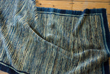 Antique Chinese rug with flowing striated indigo and cream running water motif.