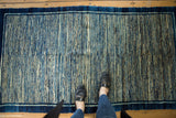 Unusual vertical indigo striations and cream tones on a circa 1900 Chinese Peking rug.