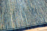 Antique Chinese Peking rug's textural striated indigo motif, echoing running water.