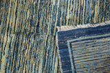 Striated indigo motif, reverse plainweave, and fringe of antique Chinese rug.