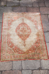 Antique Haji Jalili Tabriz mat showing its overall condition, worn edges, and soft, time-worn colors.
