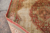 Corner detail of an antique Haji Jalili Tabriz, its low pile revealing the fine silk foundation.