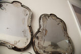 Distressed silvering and dark wood frame on curvy, bell-shaped Deco mirror.
