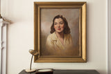 Large vintage 1950s oil portrait of a woman in cream blouse, gilded frame.