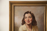 Vintage 1950s oil portrait detail, showing the woman's serene face and decorative golden frame.