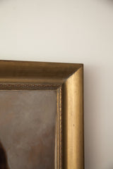 Detail of a vintage oil painting with ornate gold frame and textured neutral canvas corner.