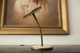 Mid Century double sided gooseneck mirror, bronze-toned stem, cream circular base.