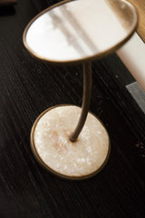 Mid century mirror's creamy lucite base and ribbed gooseneck stem.