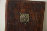 Dark patinated mahogany wood frame and a decorative antique brass latch.
