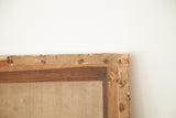 Detail of 18th century French engraving's aged paper backing with peeling and visible tacks.