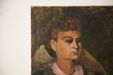 Close-up of vintage portrait showing lady's face, reddish hair, and paint chips.