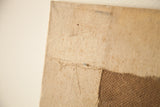 Aucello unfinished still life painting bottom edge, revealing rough canvas and backing board.