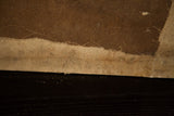 Frayed bottom edge of Aucello's unfinished antique canvas with faint script.