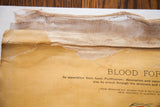 Frayed canvas backing and yellowed, torn paper on Yaggy's antique anatomical chart.