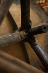 Victorian industrial stool: dark timber legs, aged iron hardware, and threaded rod.
