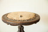 Distressed beige cloth seat with exposed horsehair, studded leather trim, and dark wood frame.