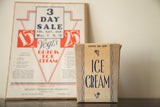 Tan Art Deco ice cream box with blue script beside sale advertisement.