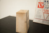 Vintage ice cream paper box, aged light brown side and top.