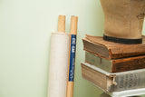 Original blue label and wooden dowels on the rolled vintage Frohse anatomical chart.