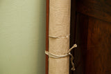 Rolled vintage 1950s pull-down chart, natural canvas exterior tied with twine.