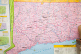 Vintage Connecticut map showing pink land, blue water, and cities like Hartford and Waterbury.
