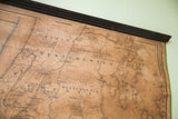 Antique 1860 New York City map detail: aged beige tones, black text, Westchester, and wooden dowel.