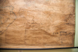 Close-up of the aged 1860 New York City map's title block and publisher.