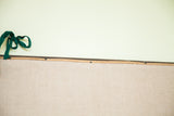 Top edge of the restored 1860 New York City map with green ribbon and linen.