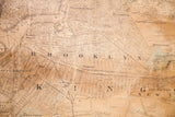 Antique 1860 NYC map detail, displaying Brooklyn's historic street grid on aged paper.