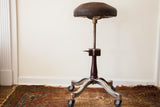 Antique 1920s Shuron Genothalmic Medical Stool, dark leather seat, curved Art Deco base.