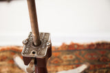 Antique Genothalmic Shuron medical stool base showing branding, rust, and lever.