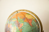 Detail of vintage Repologie globe, showing Africa, Middle East, and India in blue and earth tones.