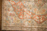 Antique circa 1910 silk Tabriz rug corner, delicate light-toned floral motifs, secured fringe.